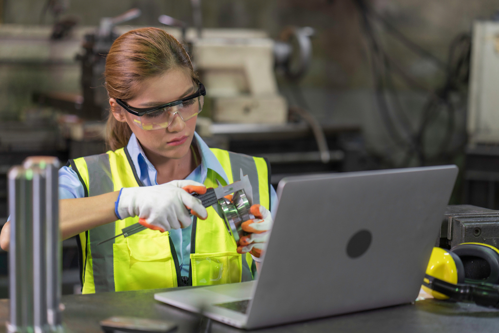 A,Women,Inspecting,checking,Steel,Part,Product,Quality,In,The,Factory