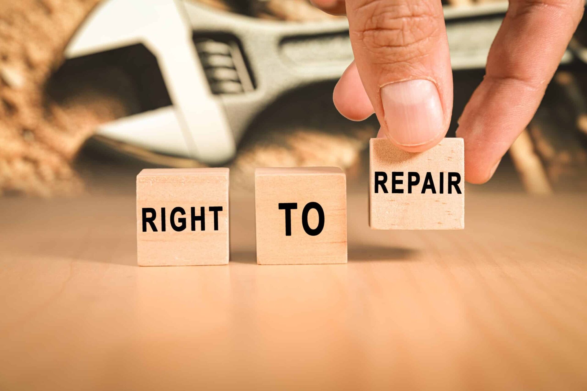 Hand,Putting,Wooden,Blocks,With,The,Right,To,Repair,Concept